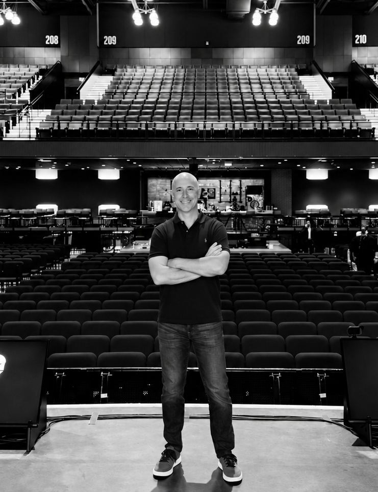 Vaughn Kohler standing on an arena stage
