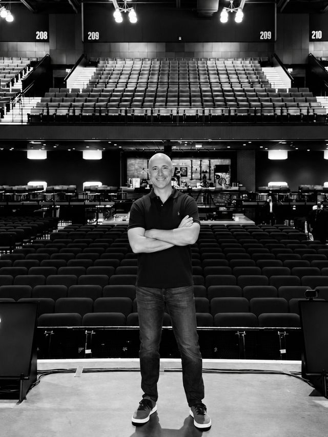 Vaughn Kohler standing on an arena stage